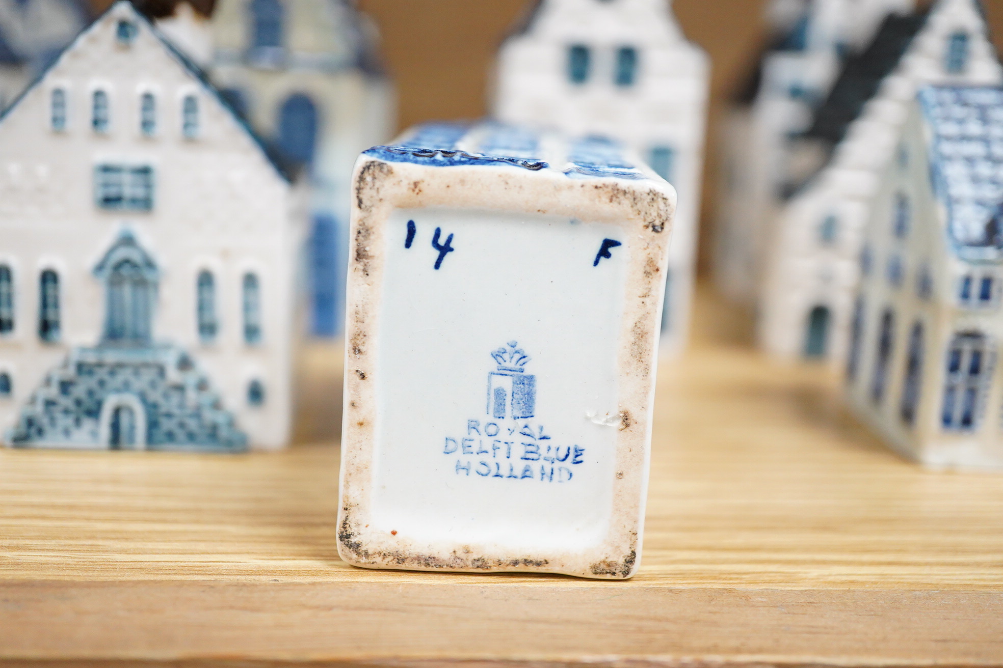 A collection of twenty seven KLM Delft blue miniature houses presented to Business class passengers together with a Delft jug - 20.5cm high